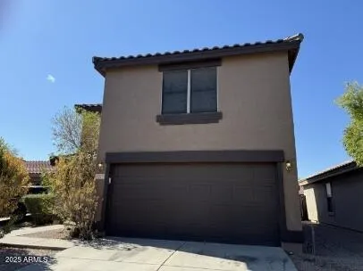 a house with trees in the background