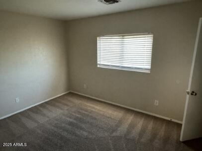 3513 South Bowman Road Apache Junction, AZ 85119 - Photo 10 of 14 an empty room with a window
