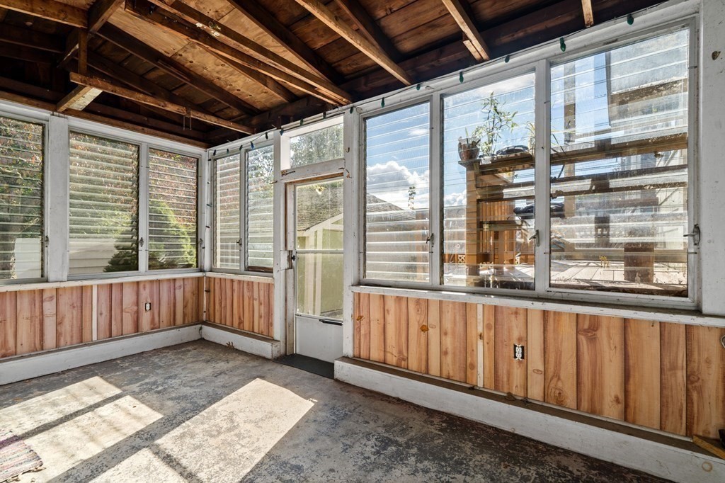14 Fairview Avenue Peabody, MA 01960 - Photo 19 of 37 a view of a porch with wooden floor and furniture