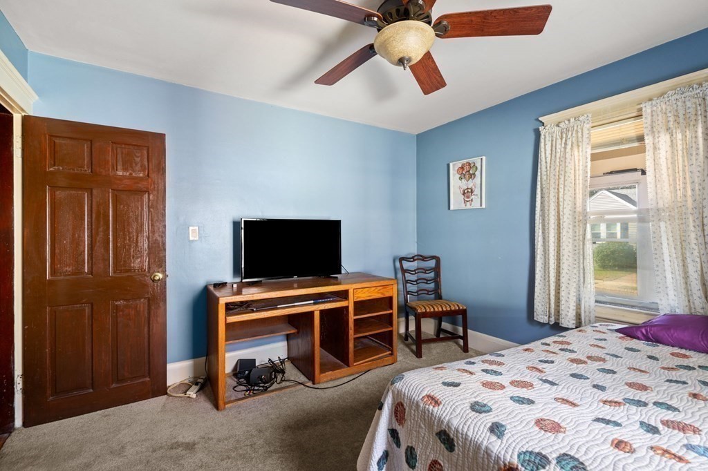 14 Fairview Avenue Peabody, MA 01960 - Photo 22 of 37 a bedroom with a bed and a flat screen tv
