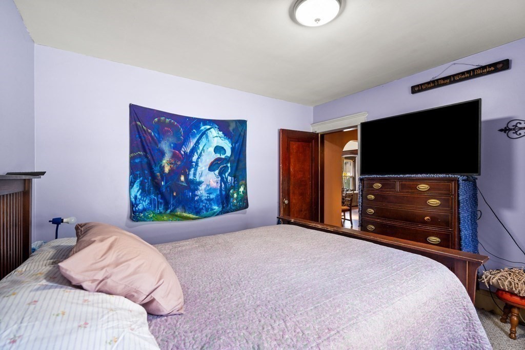 14 Fairview Avenue Peabody, MA 01960 - Photo 25 of 37 a bedroom with a bed and a flat screen tv