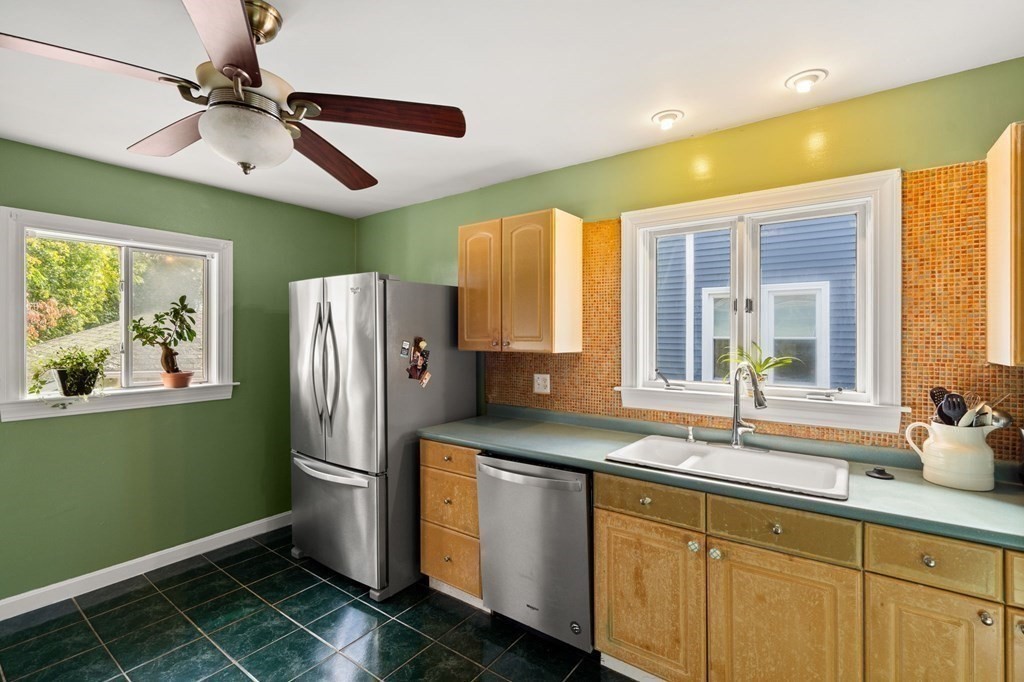 14 Fairview Avenue Peabody, MA 01960 - Photo 10 of 37 a kitchen with stainless steel appliances granite countertop a refrigerator and a sink