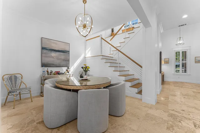 a view of kitchen with furniture and refrigerator