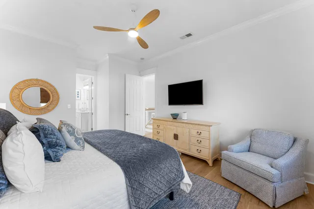 a bedroom with furniture and a book shelf