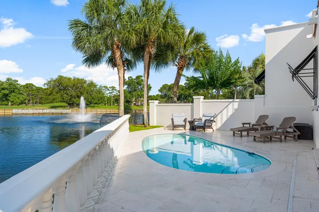 an aerial view of a house with a swimming pool