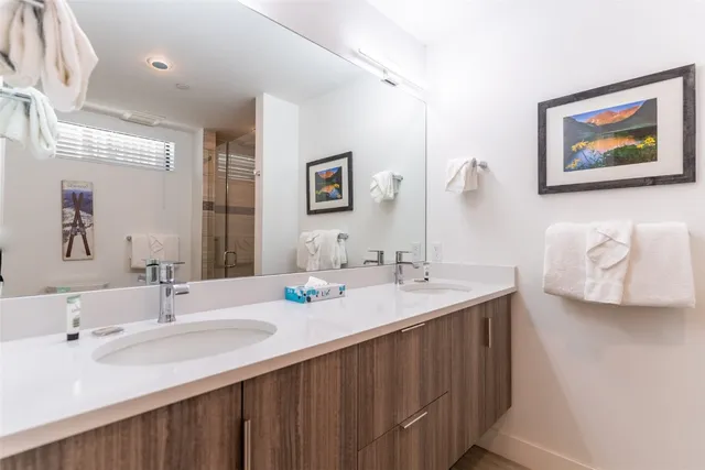 a bathroom with a shower and toilet