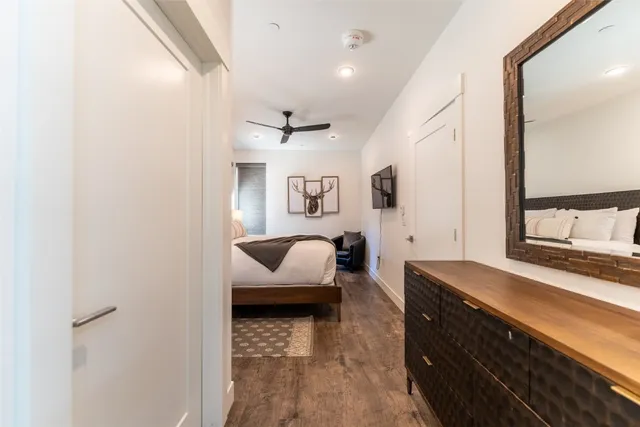 a bedroom with bed and tv