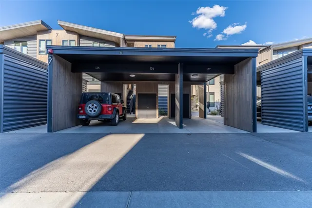 a view of a car park in front of a building
