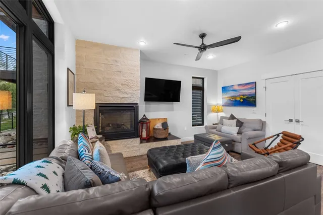 a living room with furniture and a fireplace