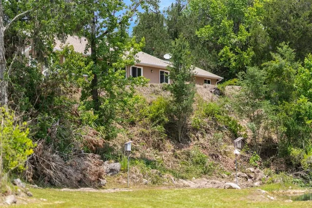 a metallic refrigerator freezer sitting in a kitchen