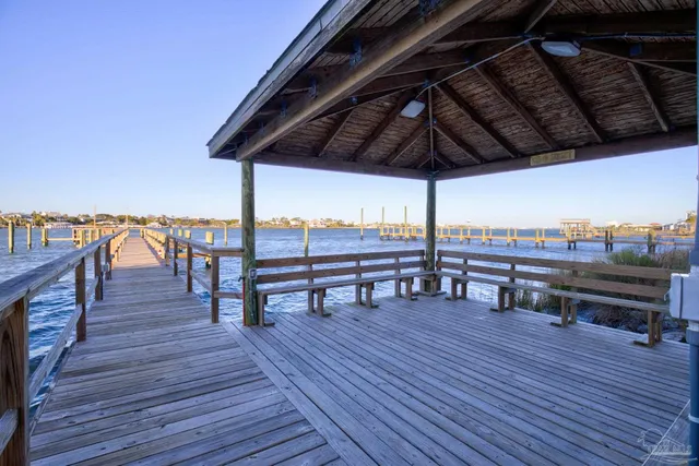 a view of chairs on the deck with wooden floor