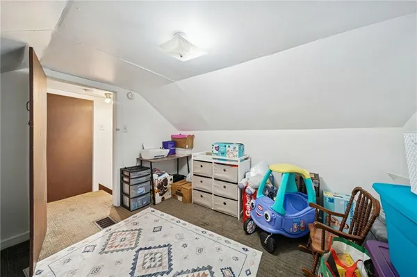 a view of a workspace with furniture and toys