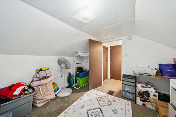 a bedroom with bed and a window