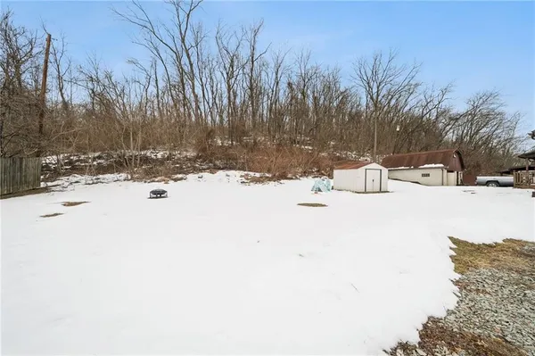 a view of snow on the side of a road