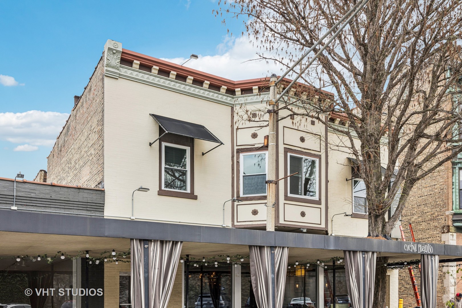 a front view of a building with large windows