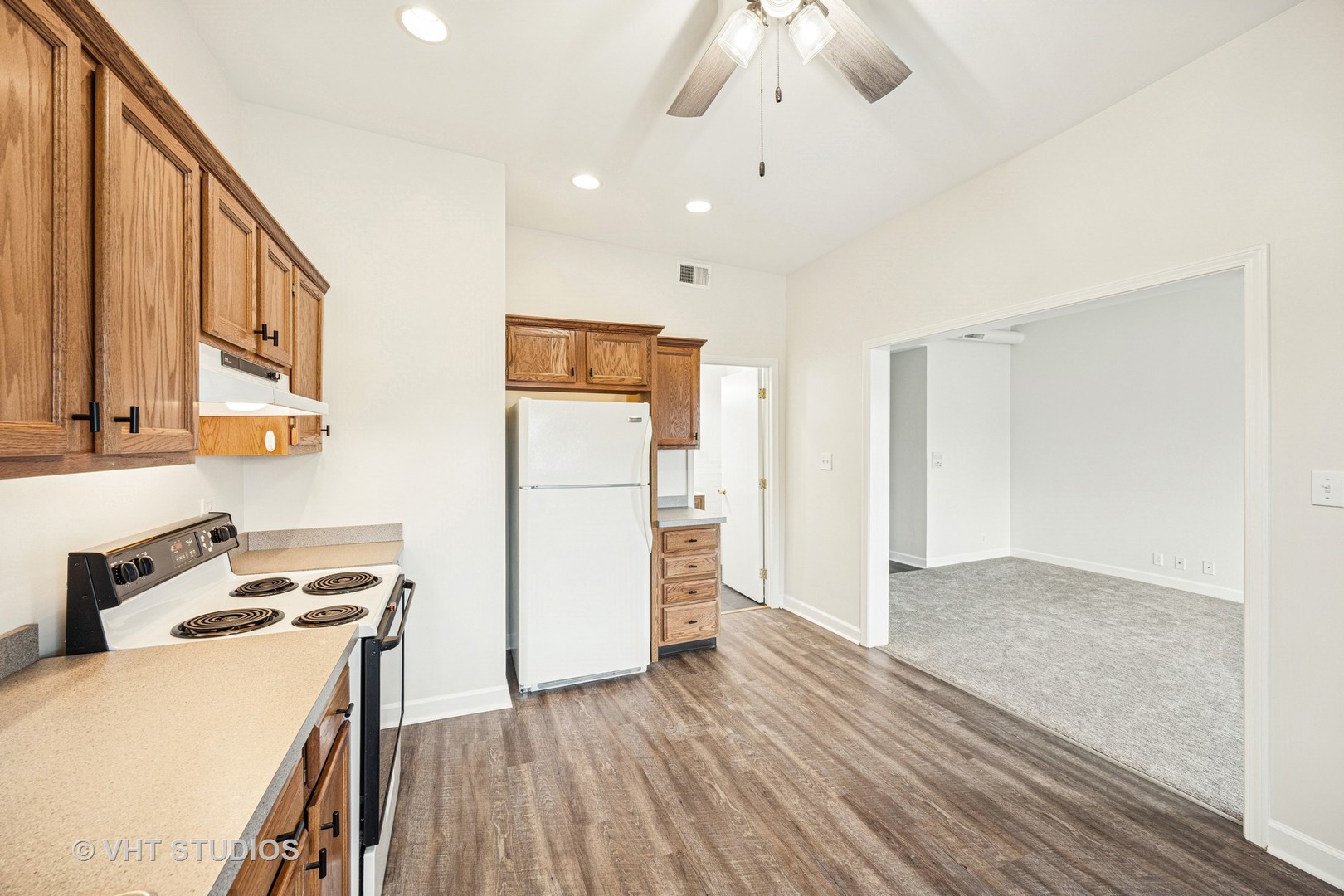 816 North Boulevard, Unit 2F Oak Park, IL 60301 - Photo 12 of 20 a view of a kitchen with a sink refrigerator and wooden floor
