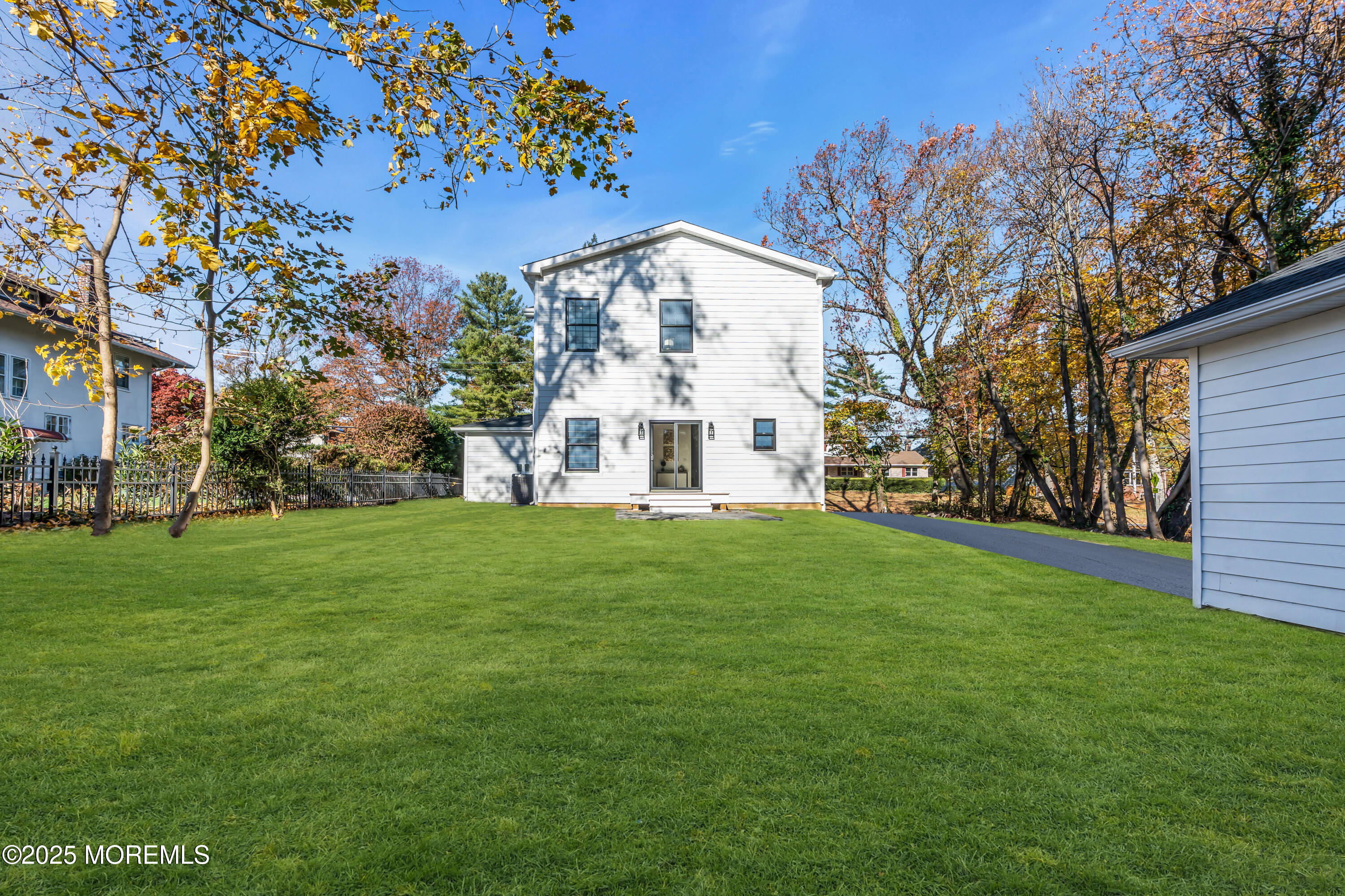 340 River Road Fair Haven, NJ 07704 - Photo 22 of 35 a view of a white house with a big yard and large tree