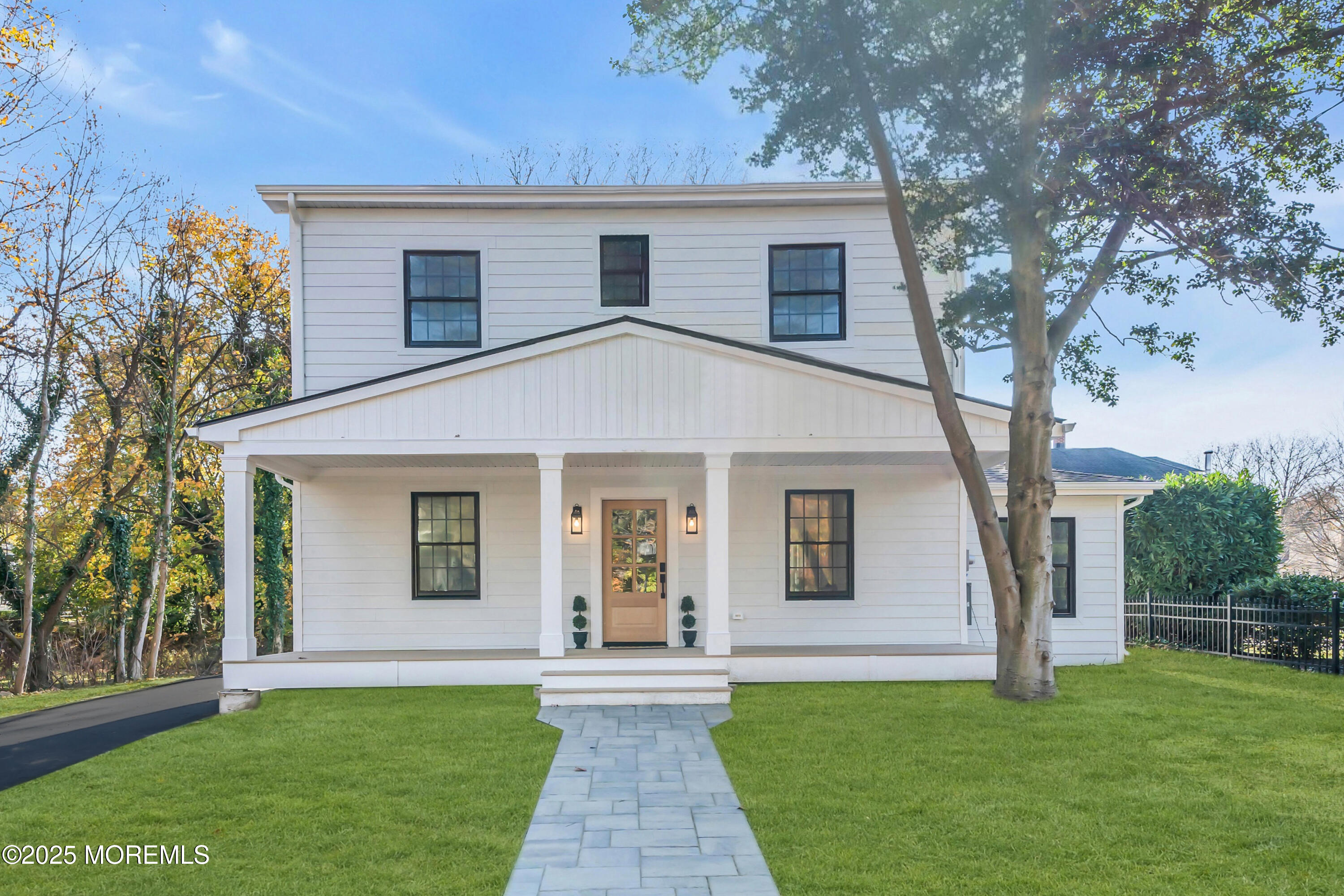 340 River Road Fair Haven, NJ 07704 - Photo 30 of 35 a front view of a house with a garden