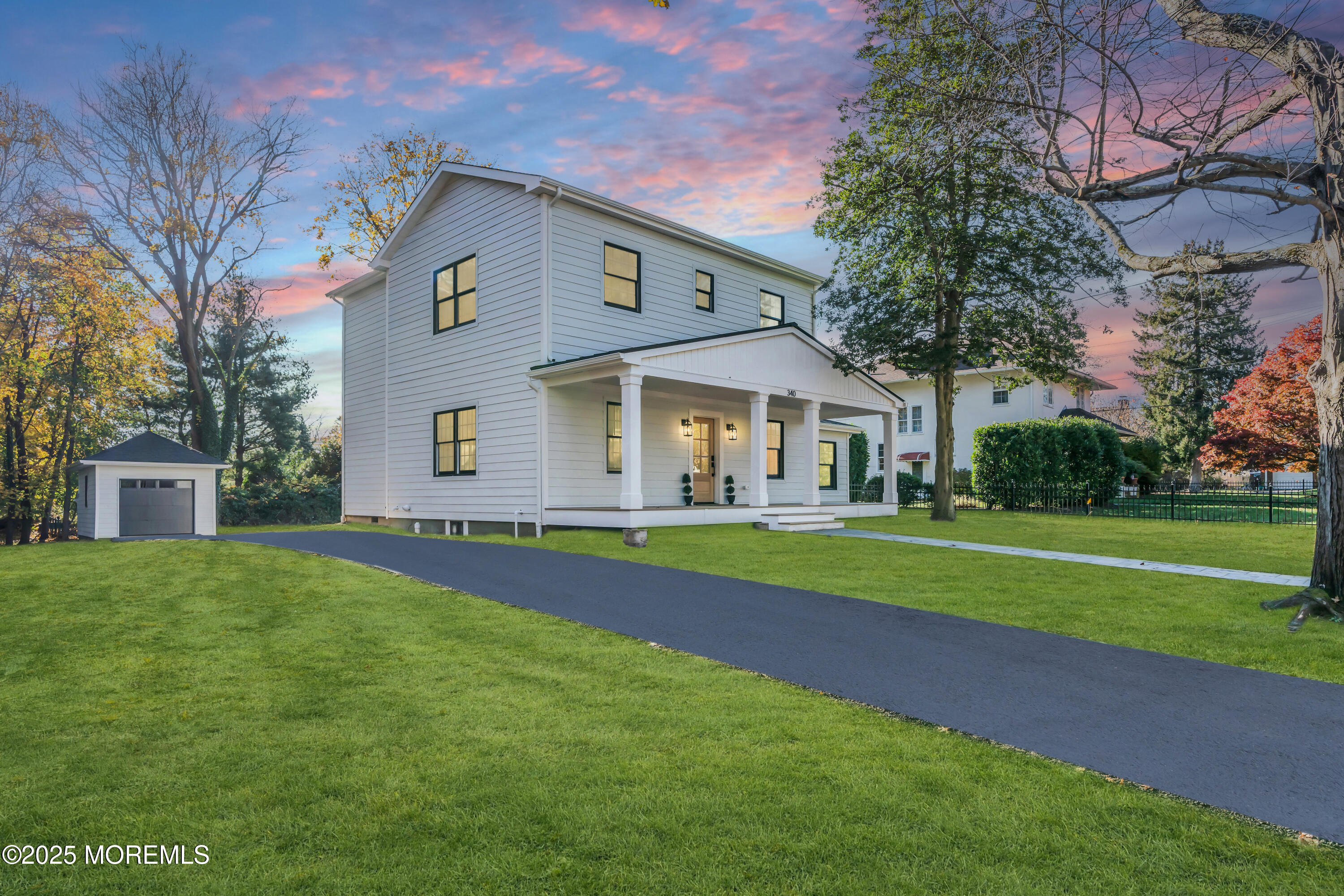 340 River Road Fair Haven, NJ 07704 - Photo 31 of 35 a front view of a house with a yard and trees
