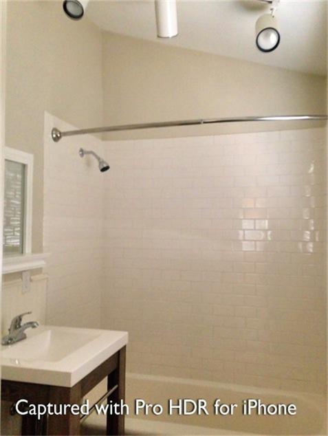 1538 Welch Street, Unit 1/2 Houston, TX 77006 - Photo 10 of 18 a view of a bathroom with a sink and a mirror