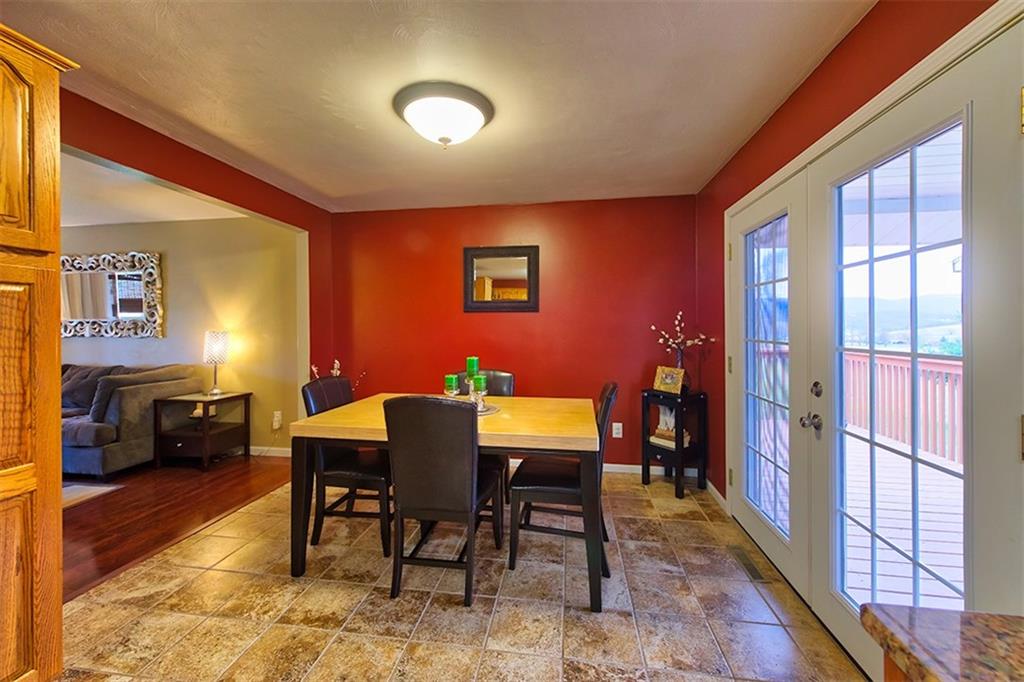 130 Prittstown Road Mount Pleasant, PA 15666 - Photo 4 of 21 Guests can move easily between the kitchen and the back deck. Serving will be a breeze with the location of the dining area food can be brought in directly from the grill or come right out of the oven.