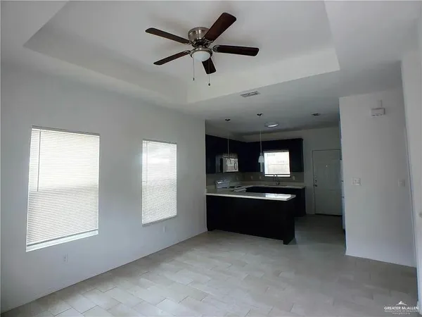 a kitchen with granite countertop a sink and a stove