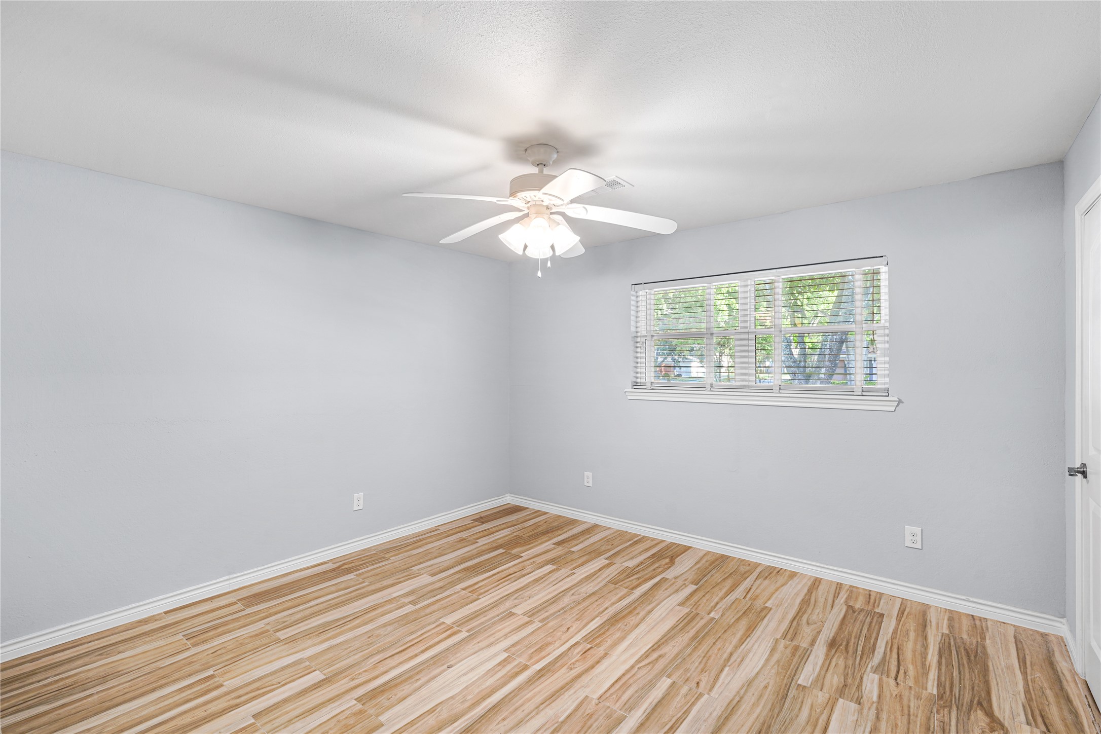 6002 McKnight Street Houston, TX 77035 - Photo 16 of 28 a view of a room with a fan & a window