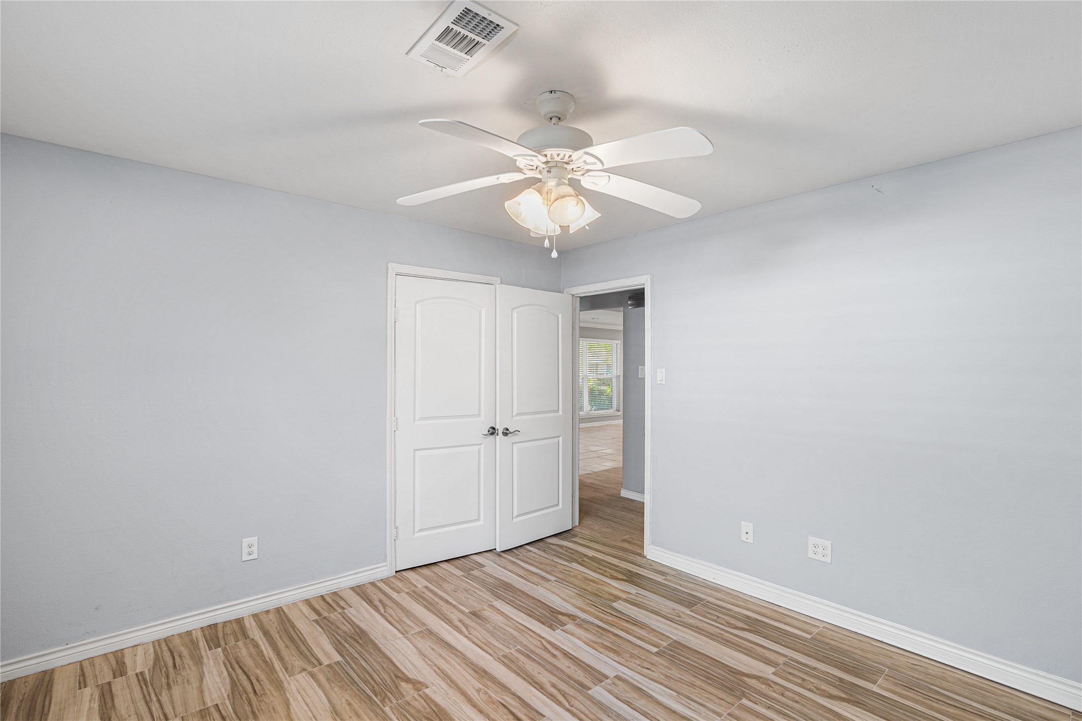 6002 McKnight Street Houston, TX 77035 - Photo 20 of 28 wooden floor in an empty room with a window