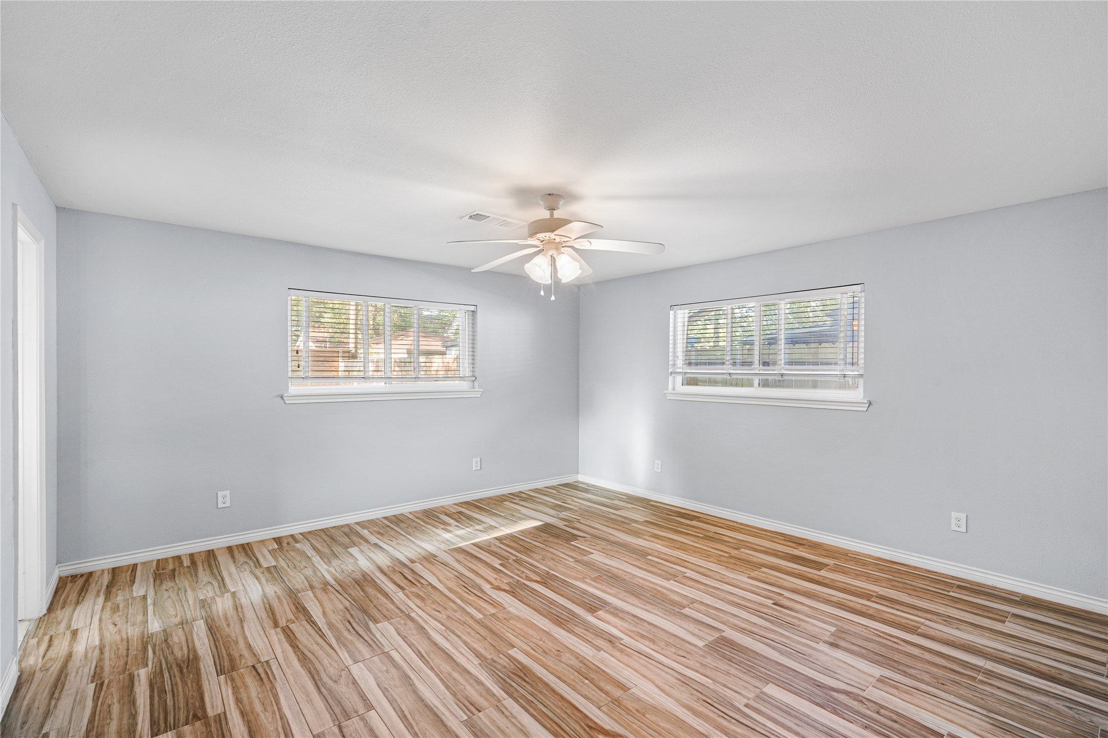 6002 McKnight Street Houston, TX 77035 - Photo 21 of 28 a view of empty room with wooden floor