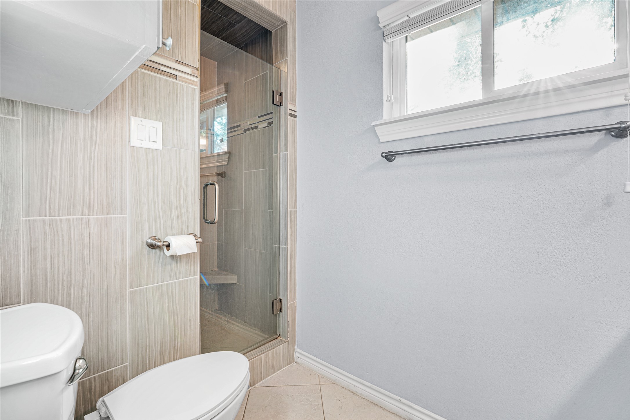 6002 McKnight Street Houston, TX 77035 - Photo 23 of 28 a bathroom with a toilet and a shower