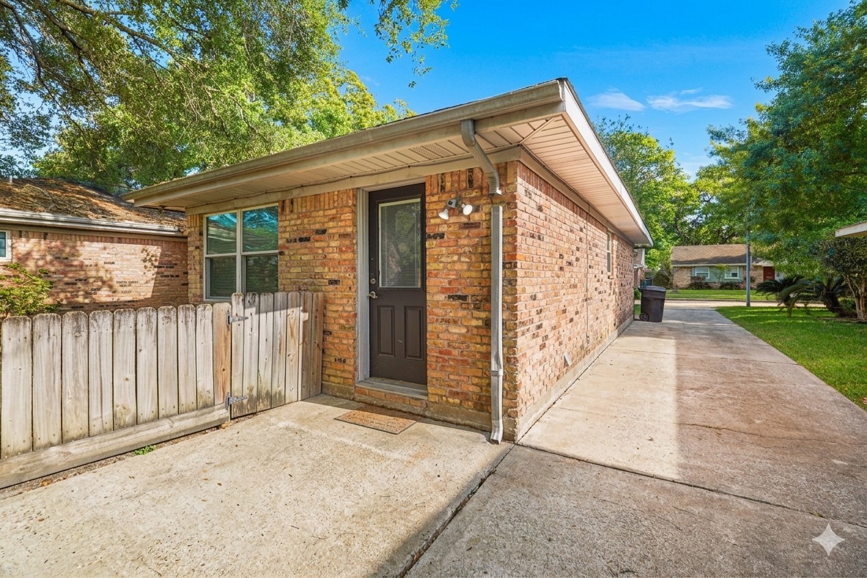 6002 McKnight Street Houston, TX 77035 - Photo 27 of 28 a view of a house with wooden fence