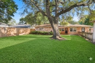 6002 McKnight Street Houston, TX 77035 - Photo 28 of 28 a house that is sitting in the grass