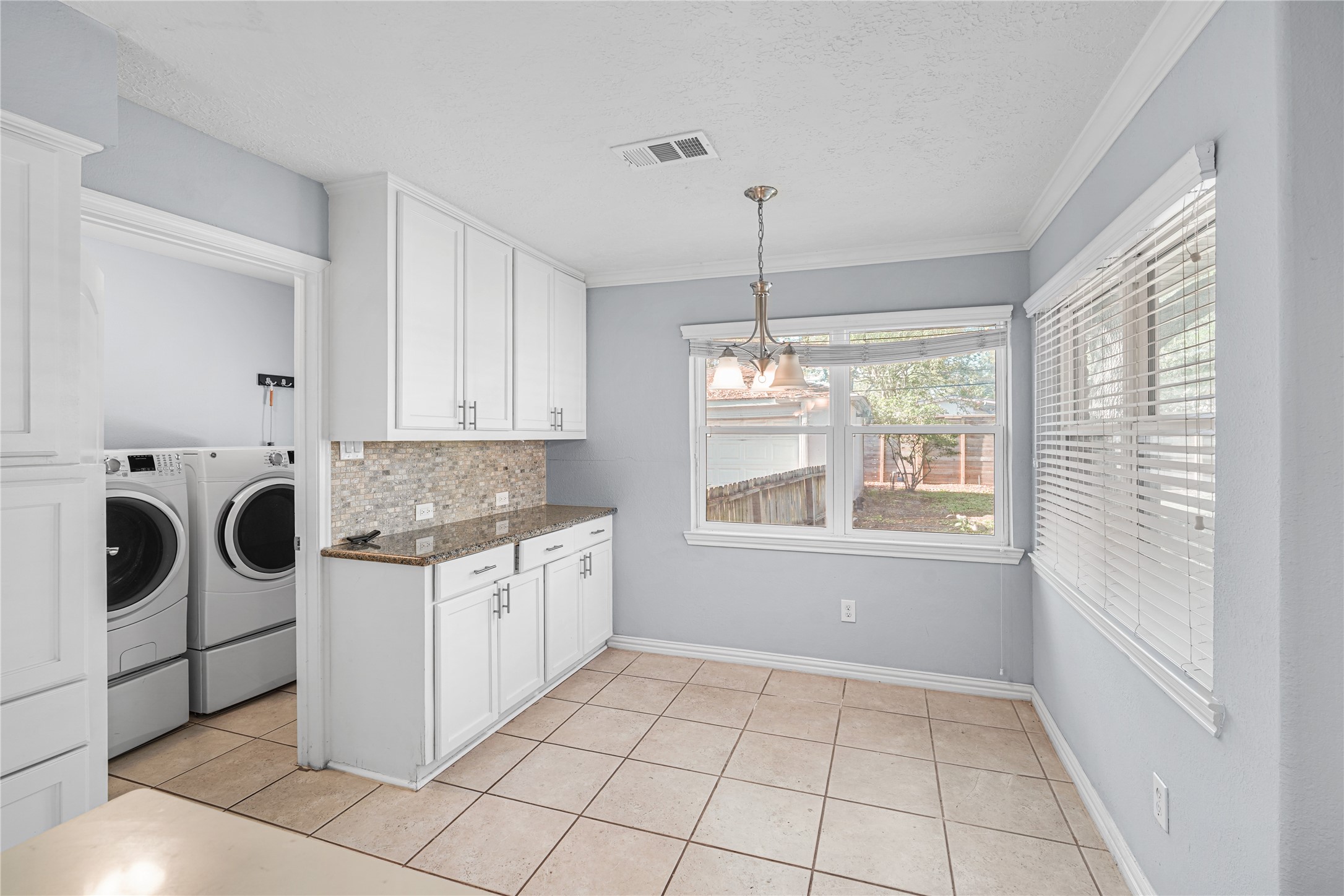 6002 McKnight Street Houston, TX 77035 - Photo 8 of 28 a kitchen with a stove a sink and cabinets