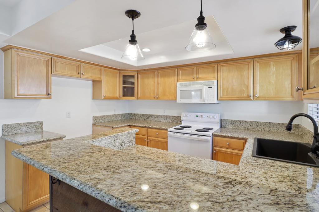 2140 Alpine Glen Place Alpine, CA 91901 - Photo 2 of 34 a kitchen with stainless steel appliances granite countertop a sink a stove and a wooden cabinets