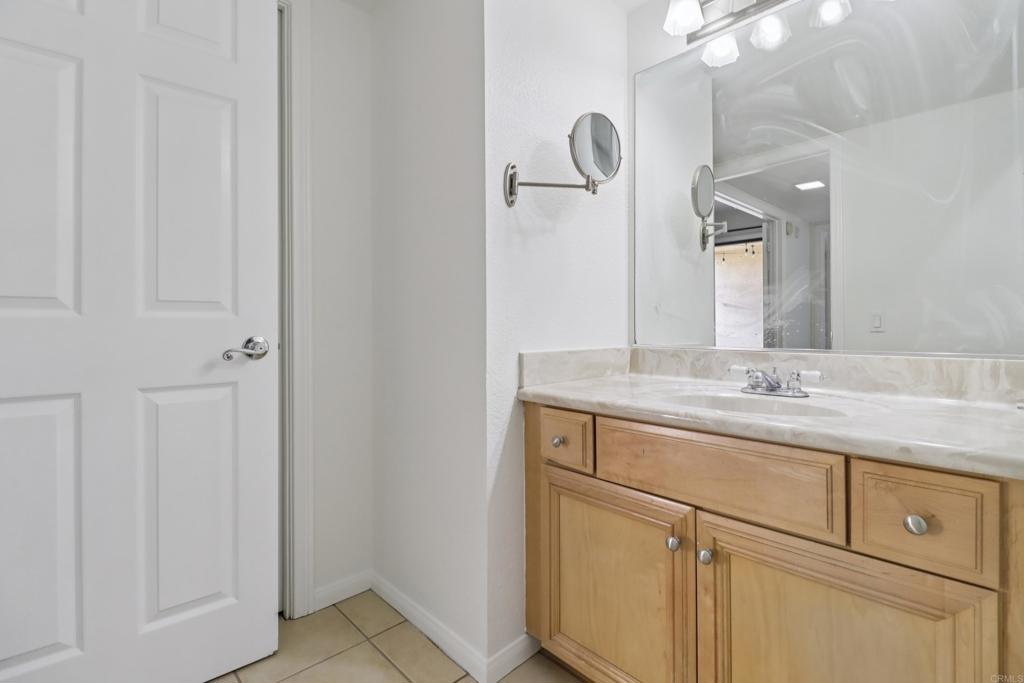 2140 Alpine Glen Place Alpine, CA 91901 - Photo 21 of 34 a bathroom with a granite countertop sink and a mirror