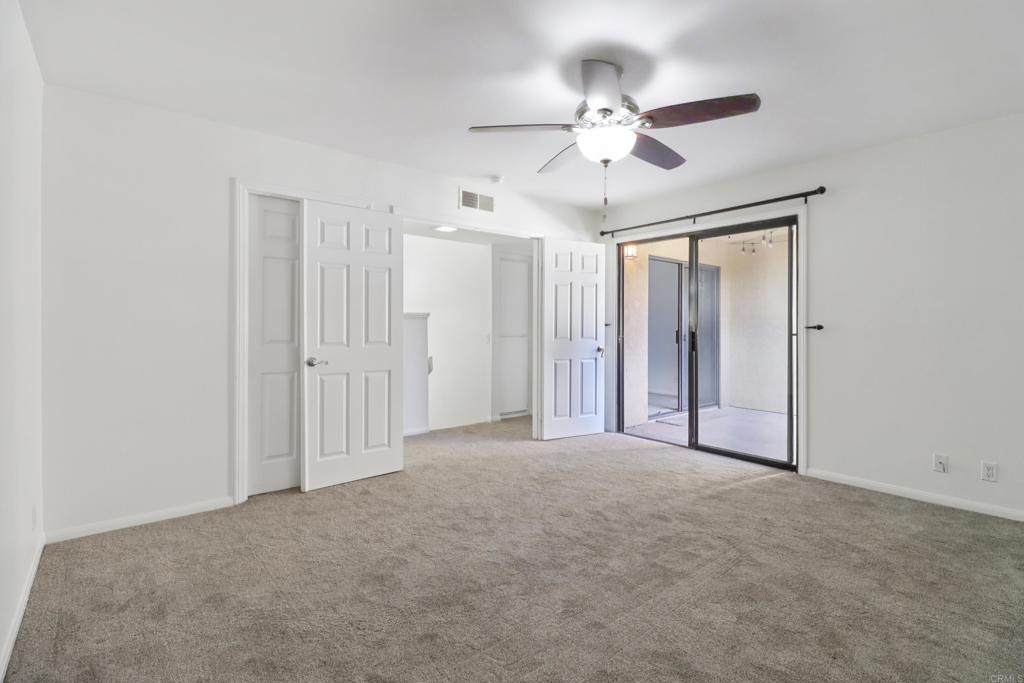 2140 Alpine Glen Place Alpine, CA 91901 - Photo 24 of 34 a view of a livingroom with a ceiling fan & windows