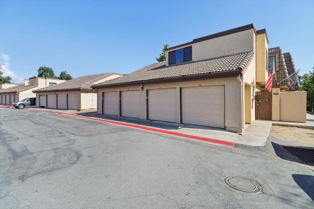 2140 Alpine Glen Place Alpine, CA 91901 - Photo 29 of 34 a front view of a house with a garage and a chair