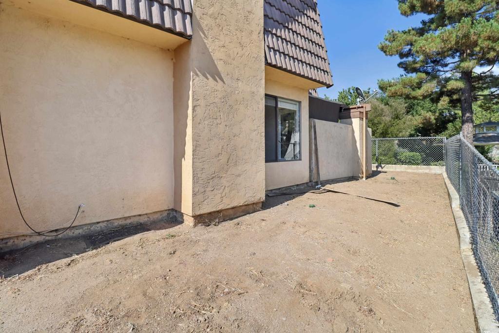 2140 Alpine Glen Place Alpine, CA 91901 - Photo 34 of 34 a view of a white house with a yard