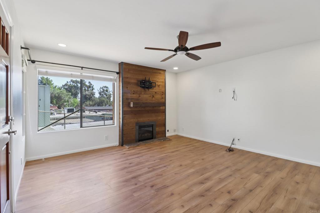 2140 Alpine Glen Place Alpine, CA 91901 - Photo 9 of 34 a view of a livingroom with a ceiling fan and window
