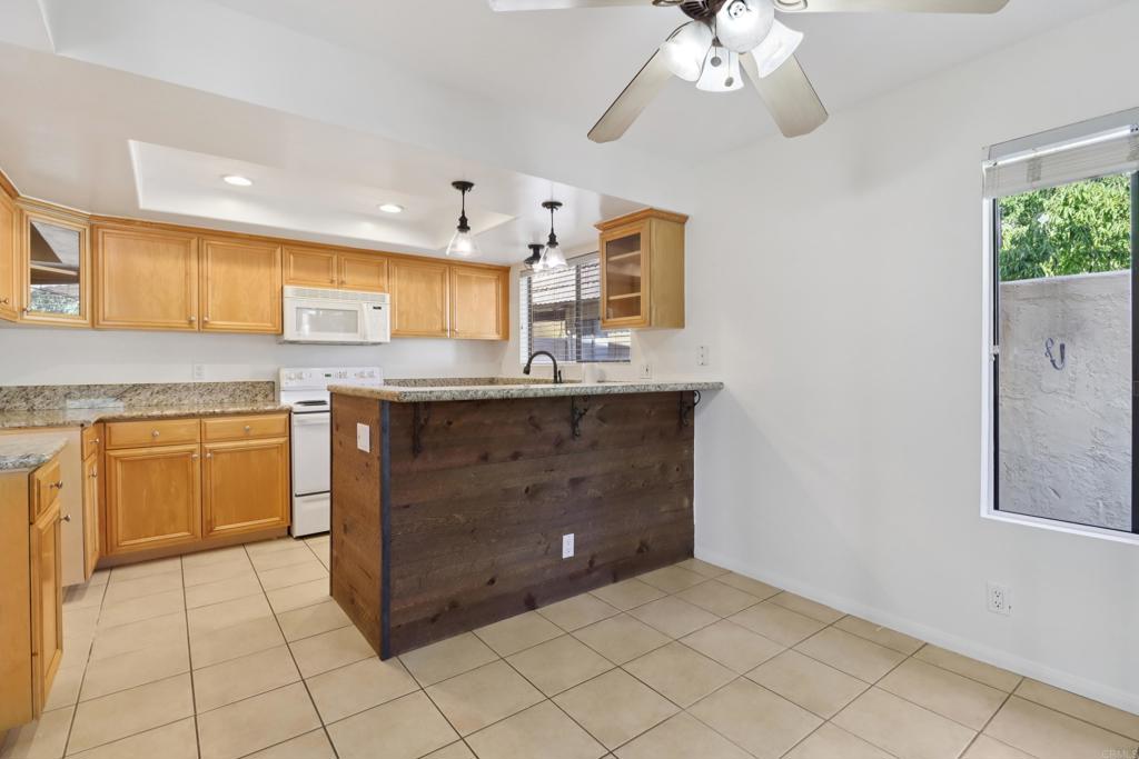 2140 Alpine Glen Place Alpine, CA 91901 - Photo 10 of 34 a kitchen with a sink cabinets and window