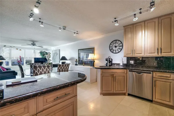 a large kitchen with lots of counter space and a sink