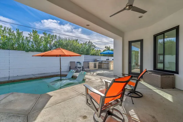 a backyard of a house with seating space
