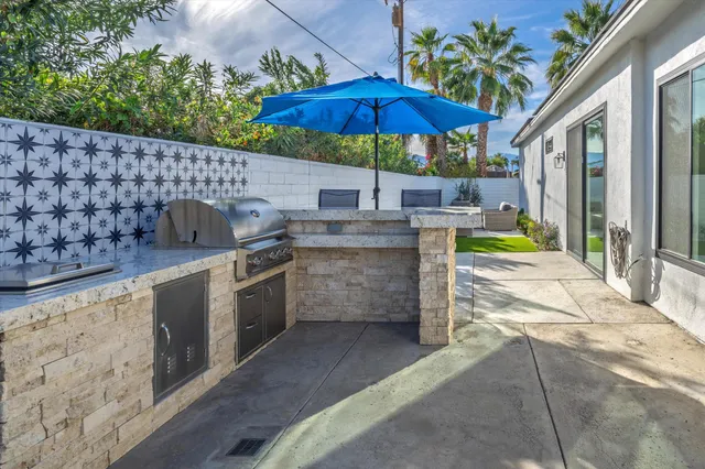 a view of a kitchen with a patio and a garden