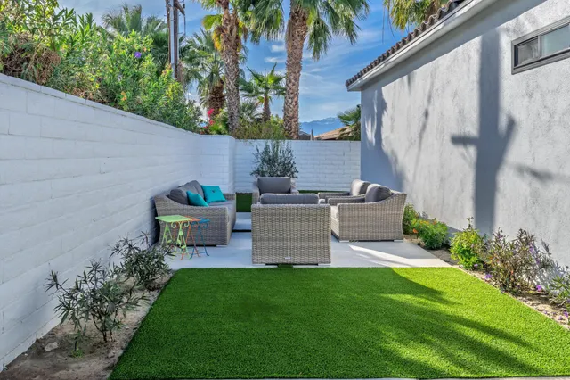 a garden view with a seating space