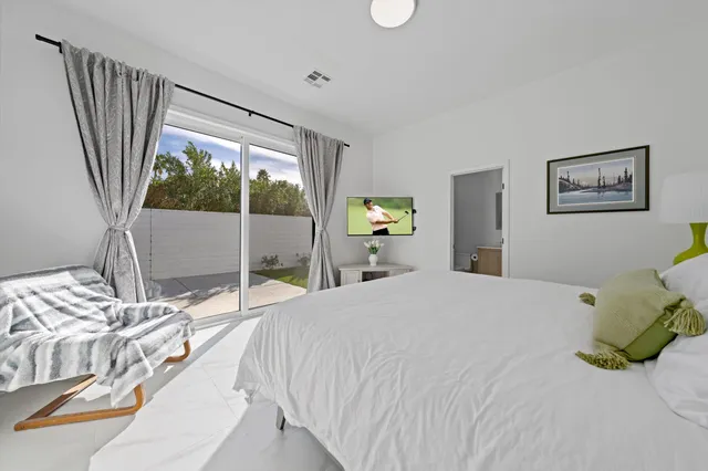 a en suite bathroom with a double vanity sink and a mirror
