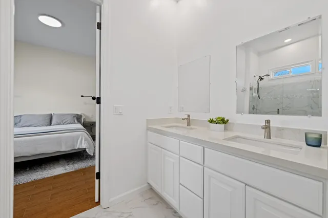 a view of a chairs and table in patio with a lake view