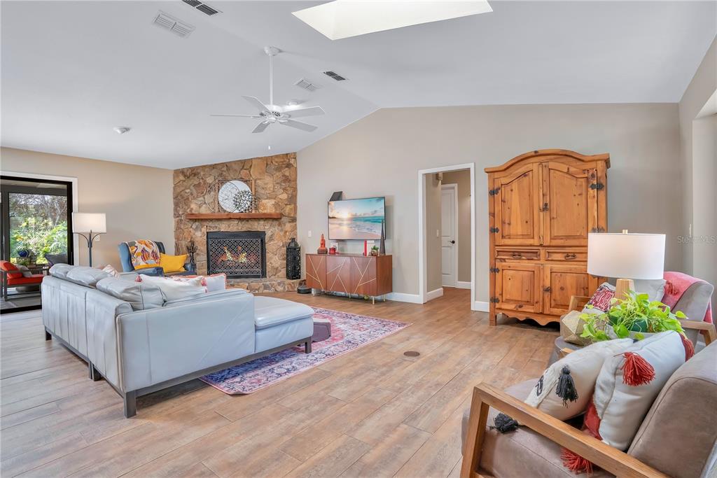 9488 Shortleaf Court Apopka, FL 32703 - Photo 12 of 60 a living room with furniture and a fireplace