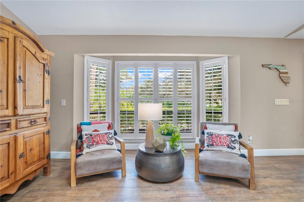 9488 Shortleaf Court Apopka, FL 32703 - Photo 14 of 60 a living room with furniture and a potted plant