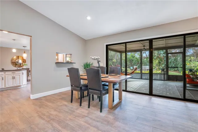 a view of a dining room with furniture window and wooden floor