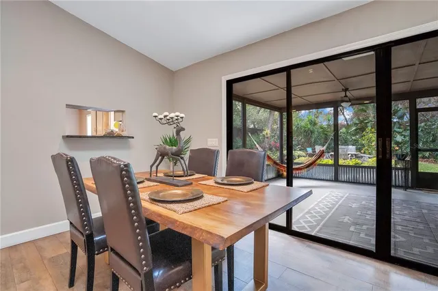 a view of a kitchen with kitchen island dining table and chairs